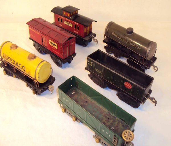 ABT: 6 Assorted American Flyer O Gauge Rolling Sto: Paul V. Ambrose and Drew J. Bauer present: These are six Rolling Stock items that American Flyer made in O-gauge circa the 1930s. Included are two Gondolas, two Tank Cars, Automobile Car, and a Caboos