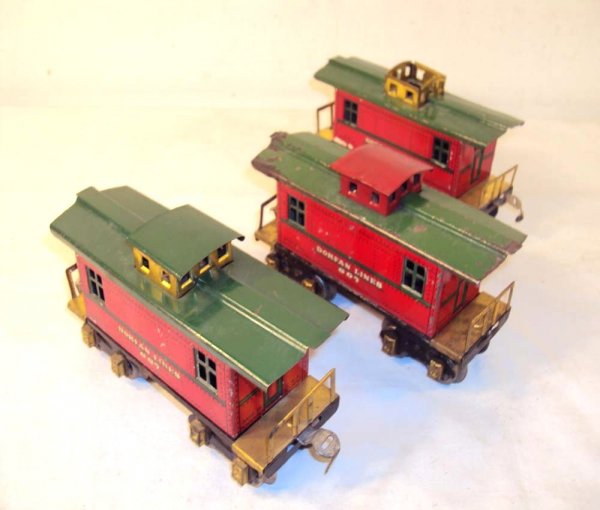 ABT: 3 Dorfan #607 Cabooses: Paul V. Ambrose and Drew J. Bauer present: These are three #607 Cabooses that Dorfan made in O Gauge circa 1930. Note Cupola variations. Please add $15.00 for US-48 Shipping and Insurance.