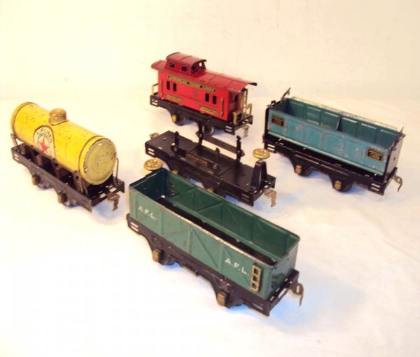 ABT: 5 Assorted American Flyer Rolling Stock Items: Paul V. Ambrose and Drew J. Bauer present: These are five assorted Rolling Stock Items that American Flyer made in O Gauge circa the 1920s. Note the black Flat Car has a "stress" bend in the middle of