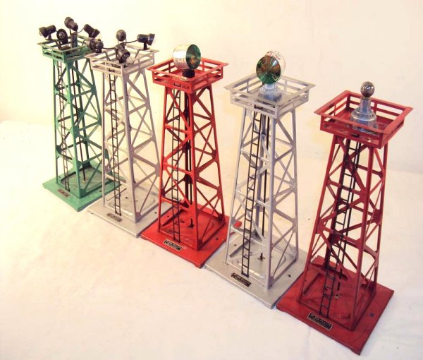 ABT: 5 Assorted Lionel Light Towers: Paul V. Ambrose and Drew J. Bauer present: These are two #394, two #395, and the #494 Light/Beacon Towers that Lionel made circa the 1950s. Note only 2 Beacons and one with issues. Please add $20.00 f