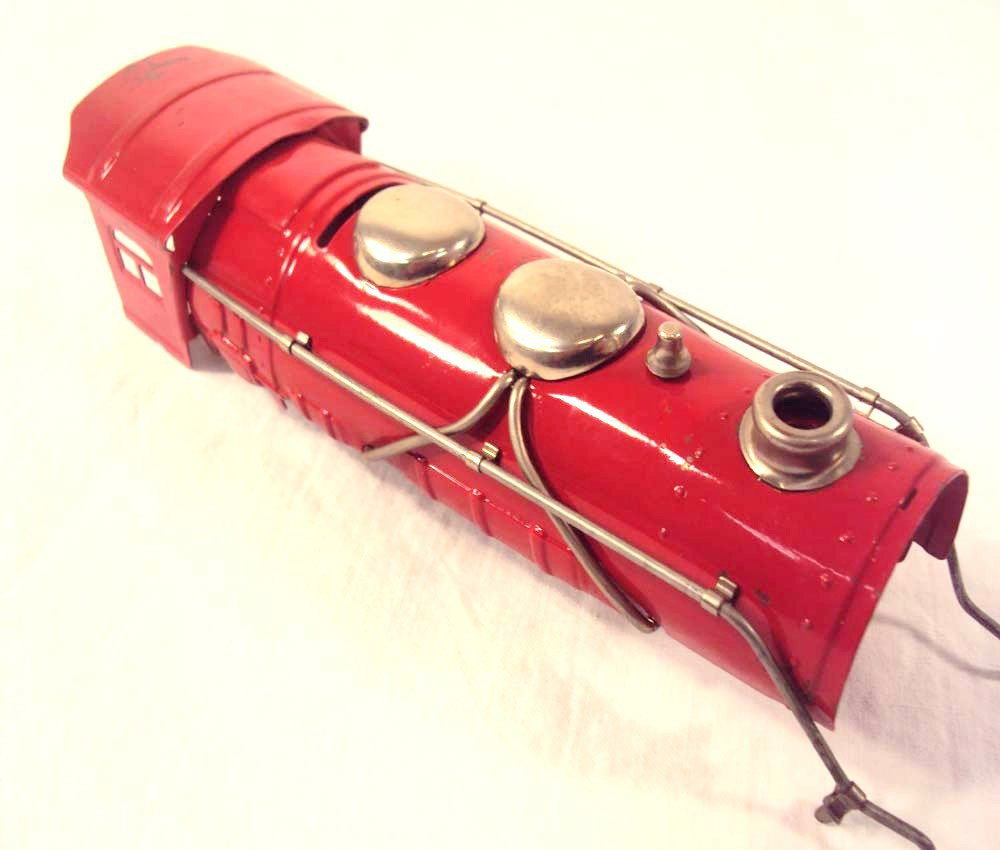 ABT: Lionel O Gauge Red-Boiler #1681E Steam Engine: Paul V. Ambrose and Drew J. Bauer present: This is the Red-boiler assembly for the #1681E Steam Engine that Lionel made in O-gauge circa 1940. Our Opinion is that it is generally in Excellent Conditio