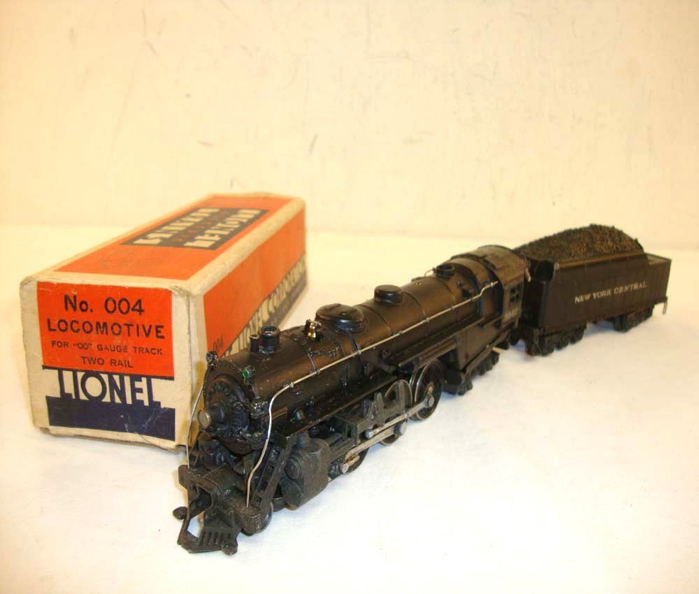 ABT: Lionel OO Gauge #004/004T Engine & Tender/OB: Paul V. Ambrose and Drew J. Bauer present: These are the #004 Engine and #004T Tender that Lionel made OO gauge circa 1940. Our Opinion is that they are generally in Very Good Condition. Includes Orig