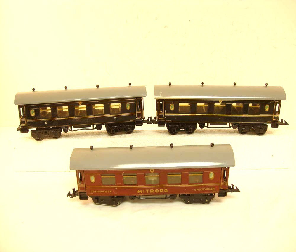 ABT: 3 Bing #10571 O Gauge Passenger Coaches: Paul V. Ambrose and Drew J. Bauer present: These are three #10571 Passenger Coaches (one example decorated as a Mitopa Restaurant Car) that Bing made in O gauge circa 1930. All examples measure approx