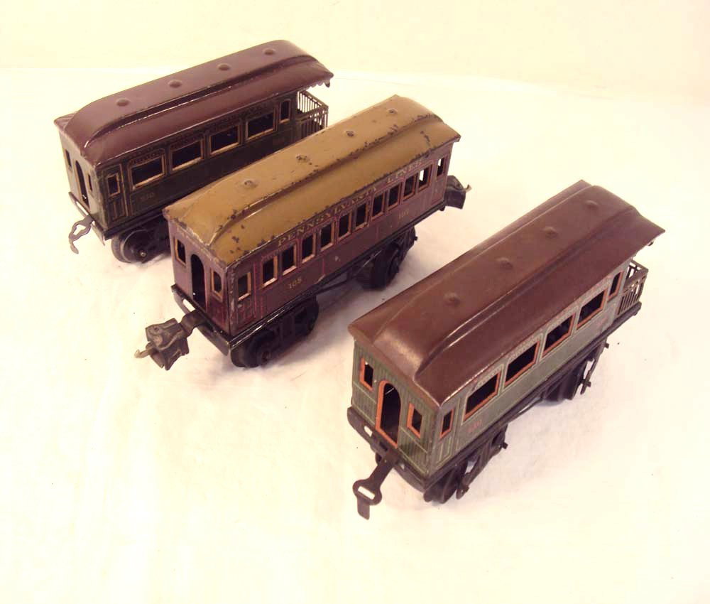 ABT: 3 Bing O Gauge Passenger Cars: Paul V. Ambrose and Drew J. Bauer present: These are the #105 Pennsylvania Coach and two #250 NYC Observation Cars that Bing made in O Gauge circa the 1920s. Note incorrect couplers on #250 and a part