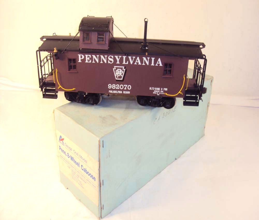 ABT: Aster 1 Gauge Pennsylvania Caboose/OB: Paul V. Ambrose and Drew J. Bauer present: This is the Pennsylvania Caboose that Aster made in 1 Gauge to go along with their Live Steam Engines. Our Opinion is that it is generally in Like New Condit