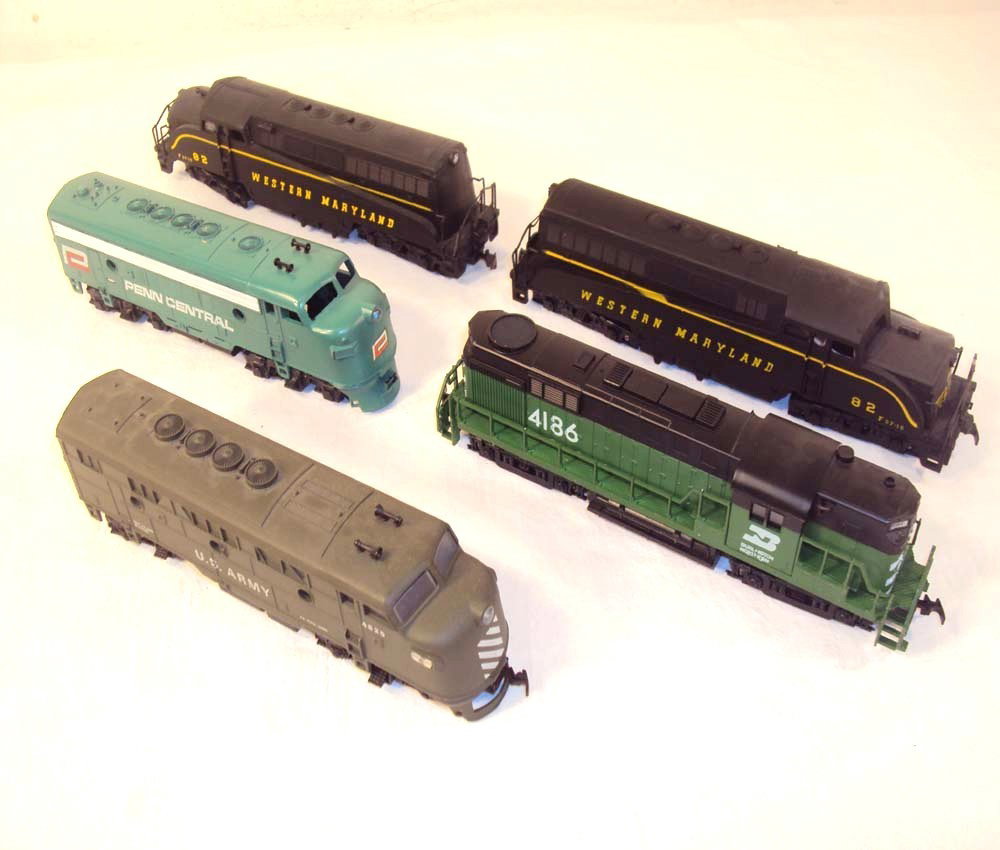 ABT: Assorted HO AHM/Mantua/Tyco Engines: Paul V. Ambrose and Drew J. Bauer present: These are the #82 Western Maryland AA Units, #4186 Burlington Northern Engine, Cox US Army Engine, and the Penn Central Engine that AHM/Mantua/Tyco made some