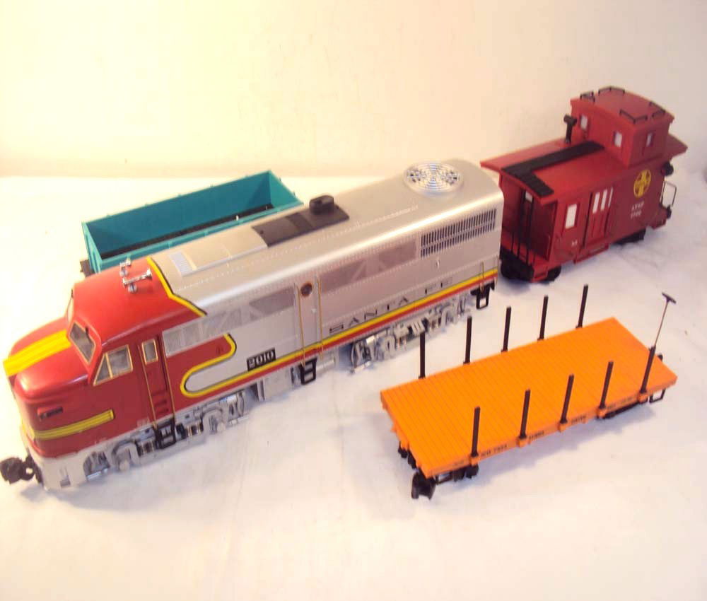 ABT: LGB #2010 SF A Unit & Three Lionel Cars: Paul V. Ambrose and Drew J. Bauer present: These are the #2010 Santa Fe A Unit and the #7403 Gondola, #7503 Illinois Central Flatcar and the #7702 ATSF Caboose that LGB/Lionel made a few years ago. No