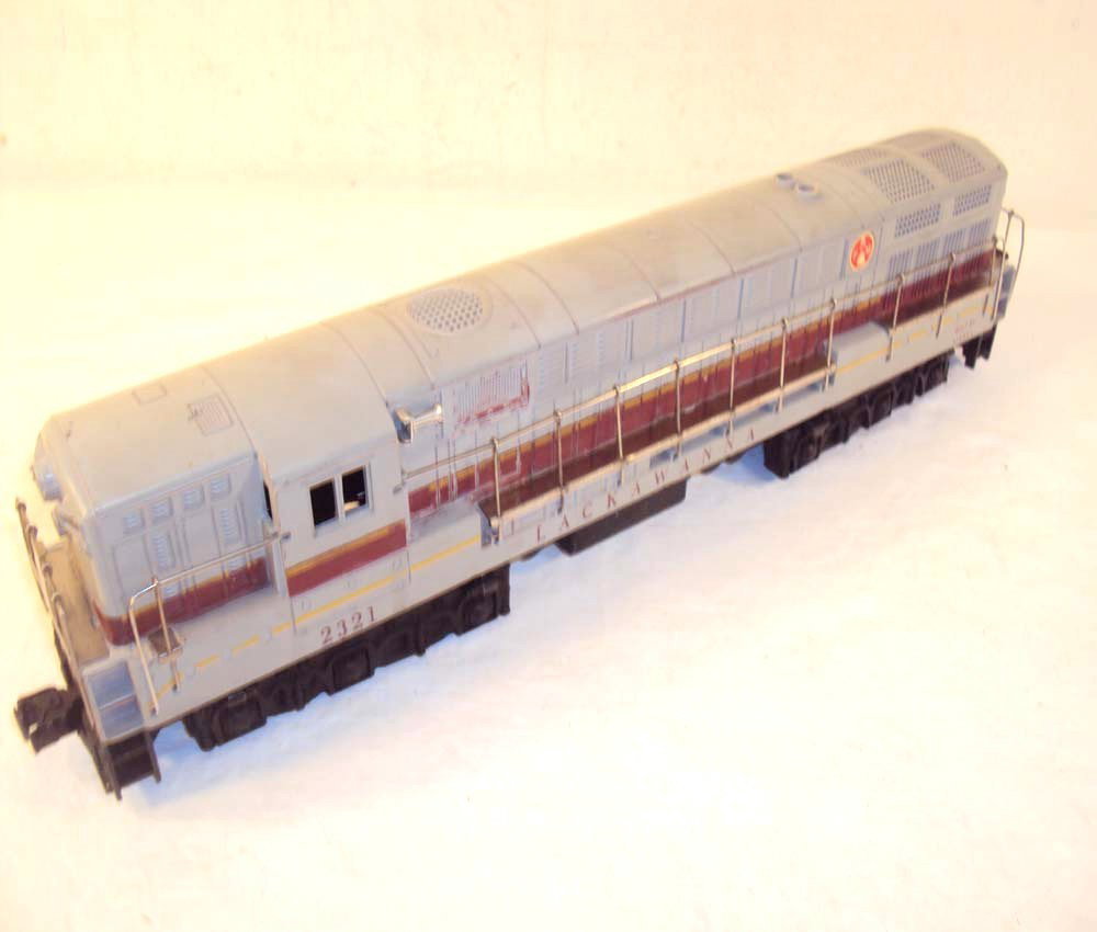 ABT: Lionel #2321 Lackawanna Grey-Roof FM: Paul V. Ambrose and Drew J. Bauer present: This is the #2321 Grey-Roof Lackawanna FM that Lionel made circa 1954. Typical screw hole cracks and battery damage inside the Frame. No Box. Please add $20.