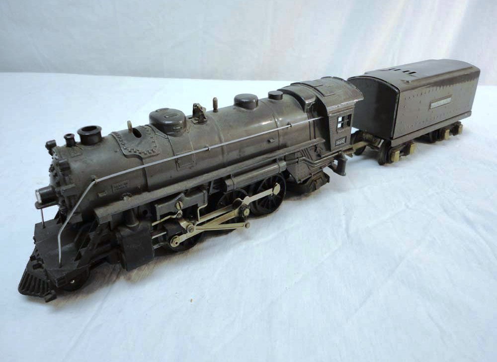 ABT: Nice Lionel Gunmetal #1666E Steam Engine & Ten: Paul V. Ambrose and Drew J. Bauer present: These are the #1666E Gunmetal Steam Engine and Tender that Lionel made circa 1940. No Boxes. Please add $20.00 for US-48 Shipping and Insurance.