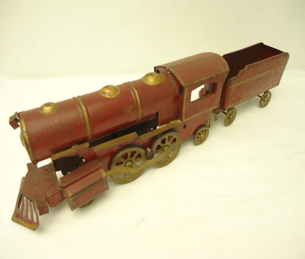 ABT: Antique Stamped-Steel Floor Train: Paul V. Ambrose and Drew J. Bauer present: This is an antique stamped-steel Floor Train and Tender by an unknown Maker (Dayton?) from a long time ago. The Engine with fly-wheel and Tender combination 