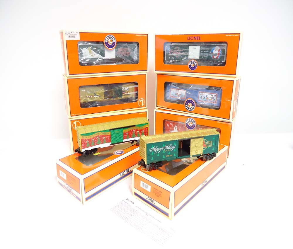 ABT: 8 Assorted Lionel Christmas Box Cars/OBs: Paul V. Ambrose and Drew J. Bauer present: These are eight Assorted Christmas Box Cars that Lionel made a few years ago. Included are the #16291 1998 Christmas Box Car, the #26243 1999 9700 Box Car, t
