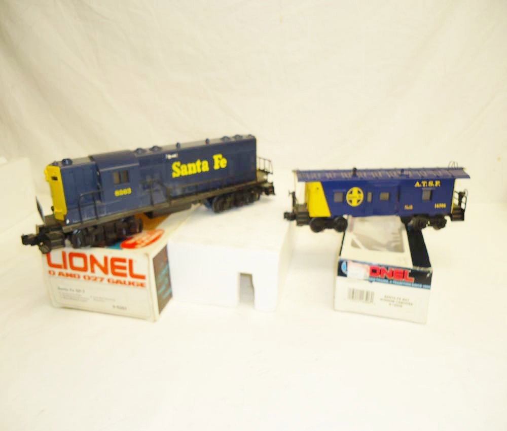 ABT: Lionel #8263 Santa Fe Blue/Yellow GP-7 & #1650: Paul V. Ambrose and Drew J. Bauer present: These are the #8263 Santa Fe GP-7 Diesel and the #16506 Bay Window Caboose that Lionel made a few years ago. Our Opinion is that they are generally in Like N