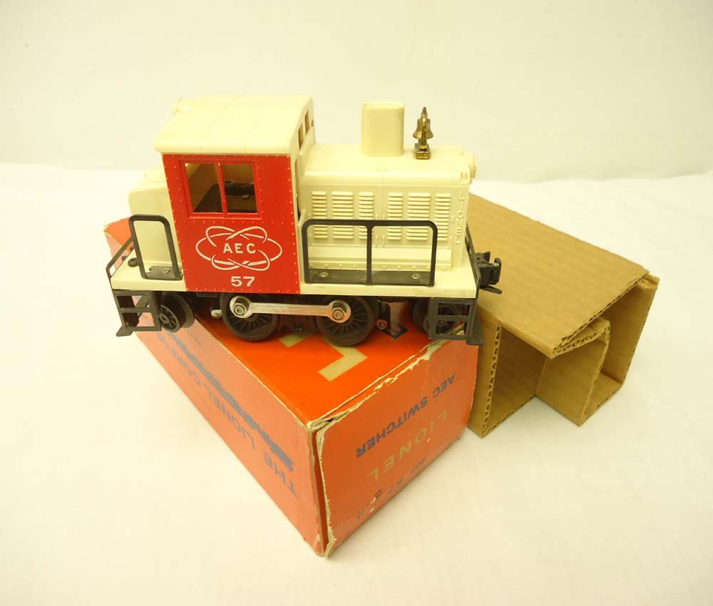 ABT: Nice Lionel #57 AEC Switcher/OB +: Paul V. Ambrose and Drew J. Bauer present: This is the very collectible #57 Motorized AEC Switcher that Lionel made in the late 1950s and early 1960s. The white plastic body has NOT turned the usual c