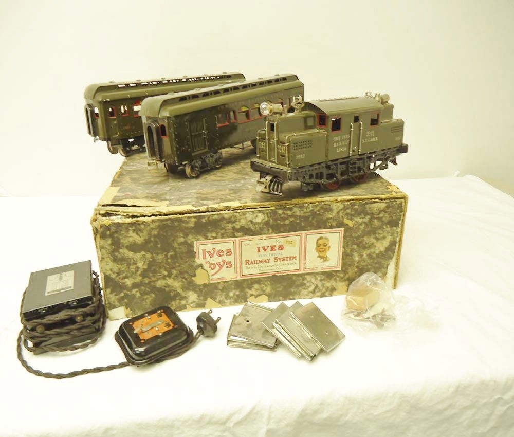 ABT: Scarce Ives Standard Gauge #702 Set w/ #3242 E: Paul V. Ambrose and Drew J. Bauer present: This is the scarce Standard Gauge #702 Set w/ #3242 Electric and #180/187 Passenger Cars that Ives made circa the 1920s. Includes the Set Box and peripherals