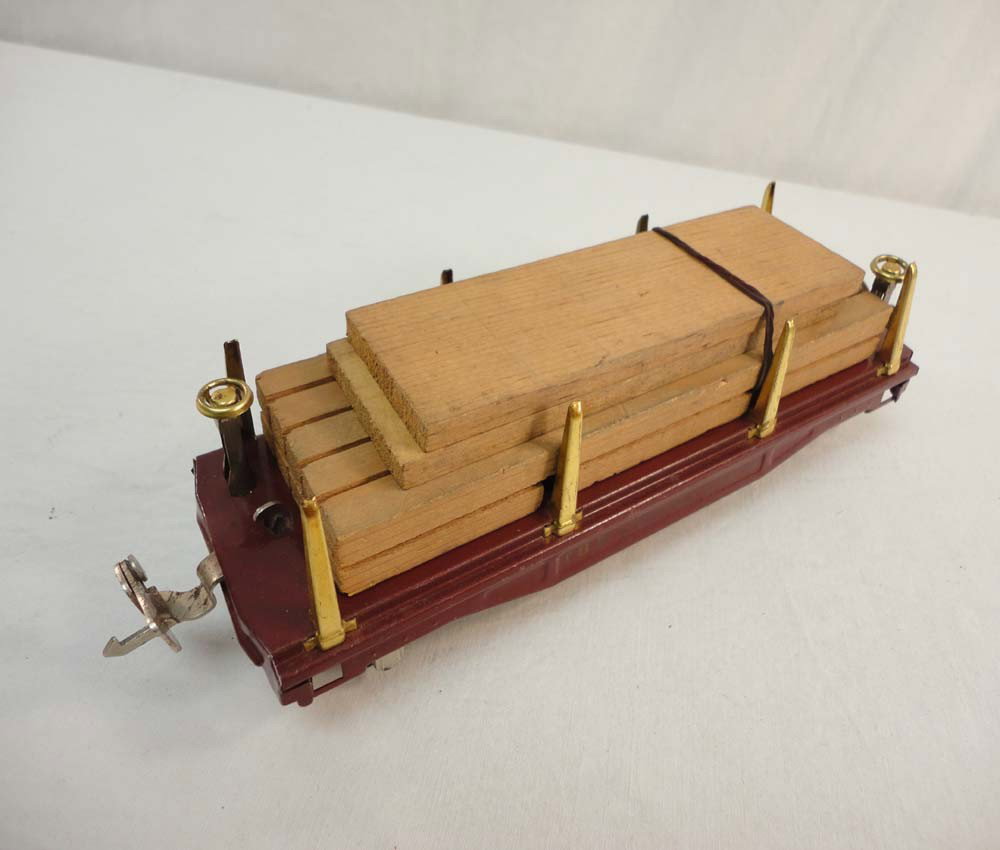 ABT: Lionel #811 Maroon Flat Car w/Lumber: Paul V. Ambrose and Drew J. Bauer present: This is the #811 Maroon Flat Car w/Lumber that Lionel made in O gauge circa in the 1920s. No Box. Our Opinion is that it is generally in Very Good Condition.