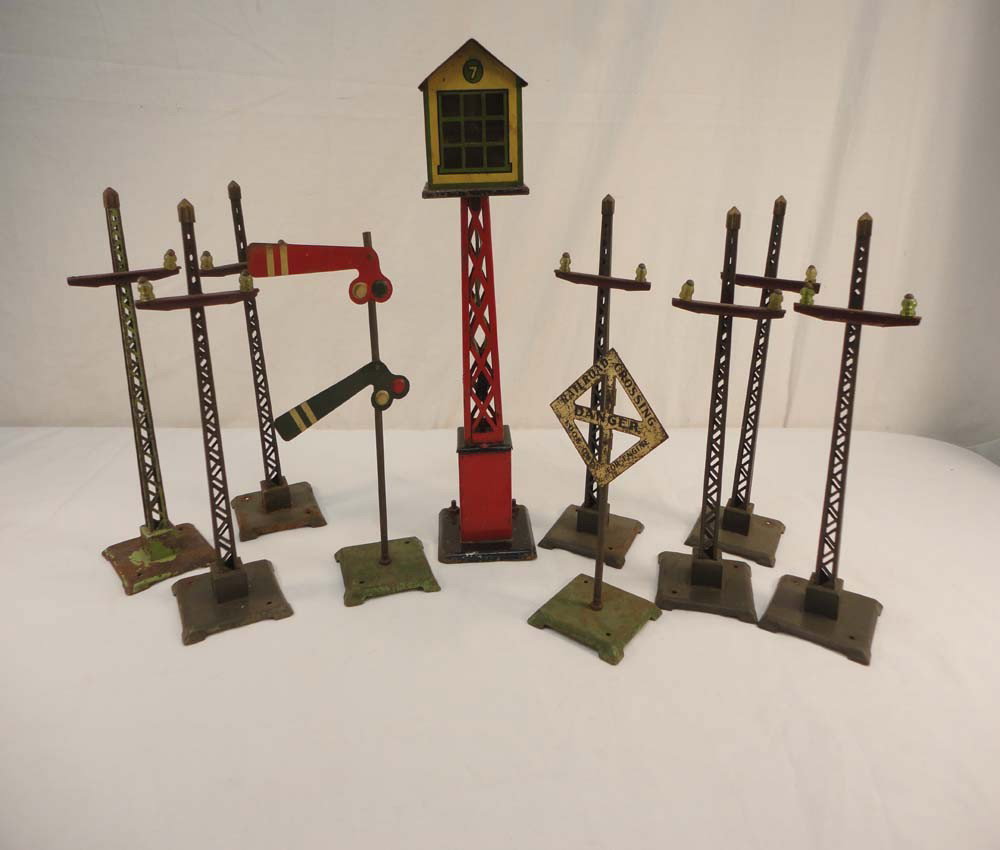 ABT: Lionel/AF Assortment Telephone Poles/Signs/: Paul V. Ambrose and Drew J. Bauer present: This is an assortment of Telephone Poles (Lionel), Signs (AF), and Radio Control Tower (Marx) that Lionel and Marx made Pre War. What you see is what you wil