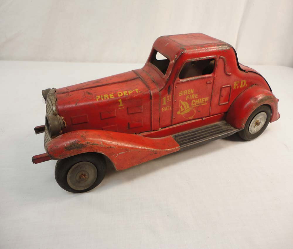 ABT: Great Old Marx 'Fire Chief' Friction Car: Paul V. Ambrose and Drew J. Bauer present: This is the 1st Battalion Fire Chief Friction Car that Marx made long ago. It measures approx. 15-inches in length. Examine the pictures carefully. Please ad