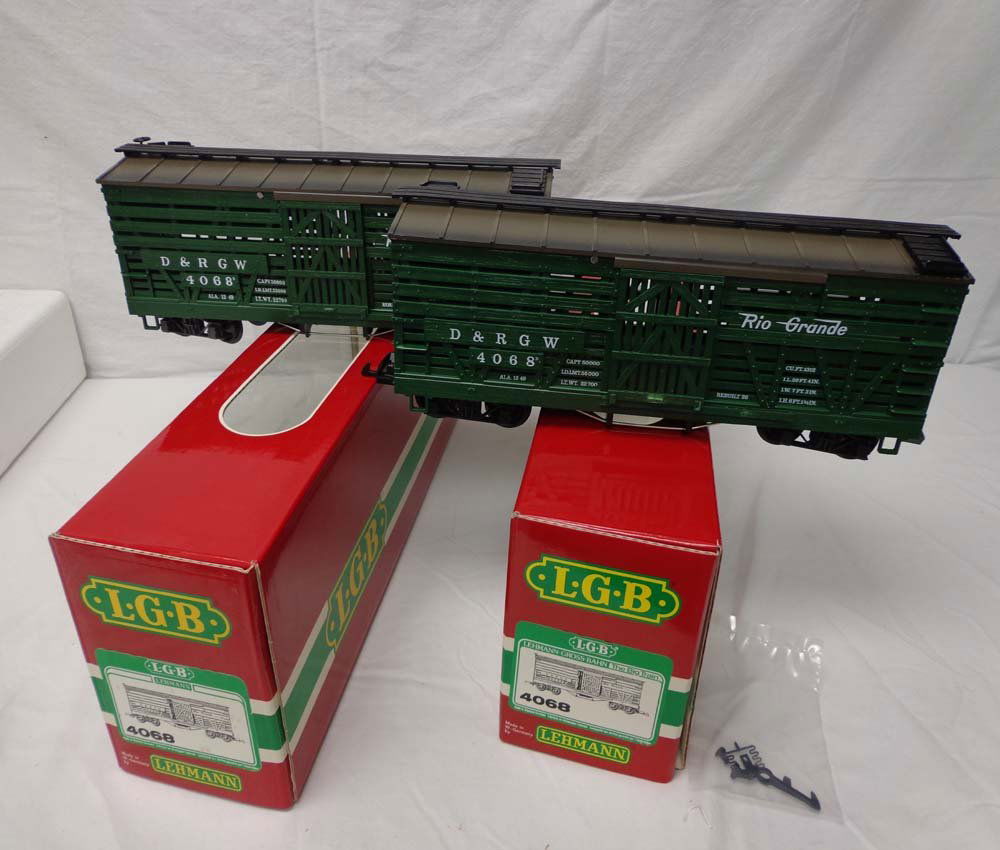 ABT: LGB G Scale: 2 #4068 D&RGW Stock Car/OBS: Paul V. Ambrose and Drew J. Bauer present: These are two #4068 D&RGW Stock Cars that LGB made for G Scale a few years ago. Our Opinion is that they are generally in Like New Condition. Original Boxes.