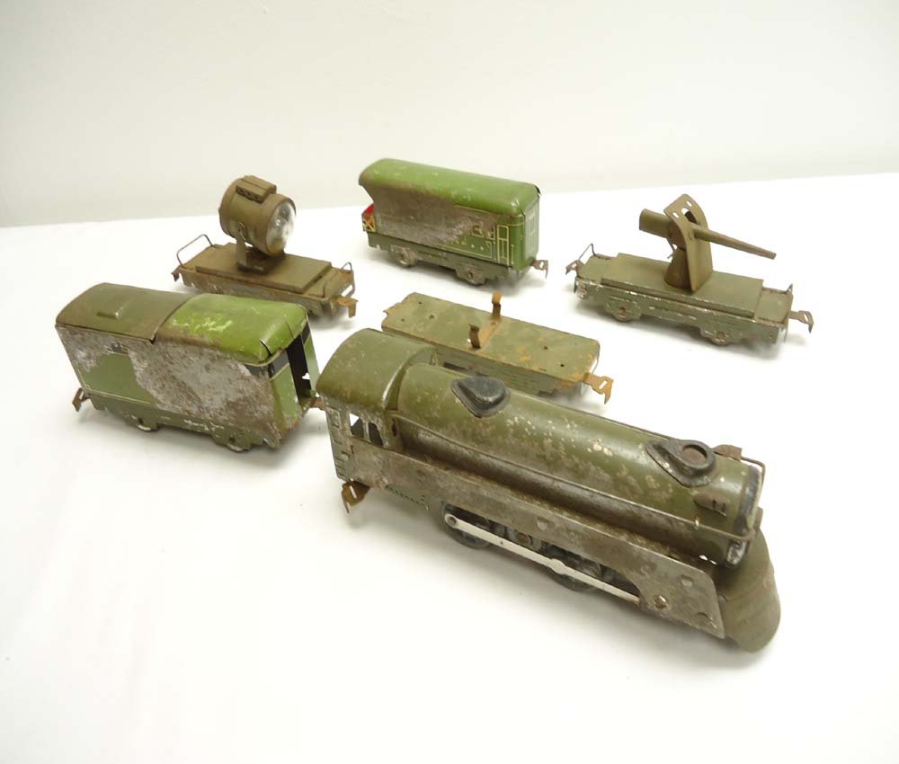 ABT: Marx 6-item Army Train: Paul V. Ambrose and Drew J. Bauer present: This is the 6-item Army Train that Marx made Pre War. Included are the Steam Engine/Tender plus four Rolling Stock items as pictured. No Boxes. Please add $2