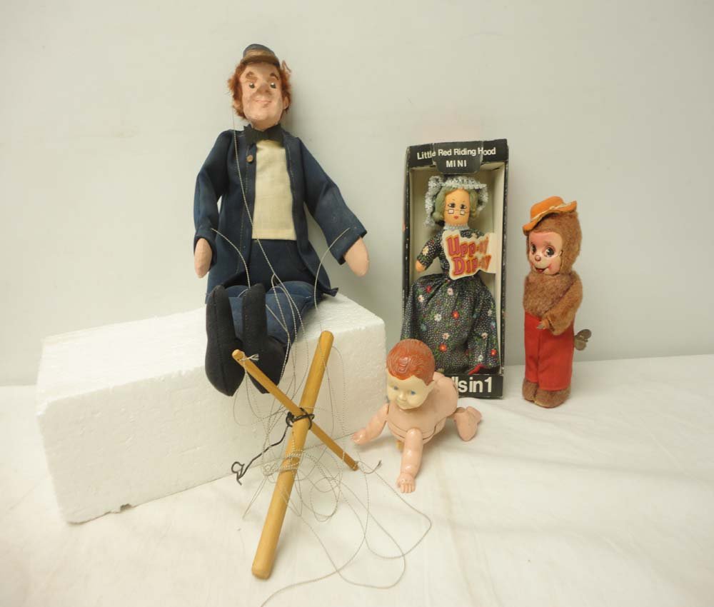 ABT: Unusual Puppet, 2 Wind-up Dolls & Uppsy Dipsy: Paul V. Ambrose and Drew J. Bauer present: This is an interesting Lot of female-oriented childhood Toys. Included are moving Infant, wind-up Chimp, Upp-sy- Dip-sy 3-in-1 Doll, and working Puppet w/Str