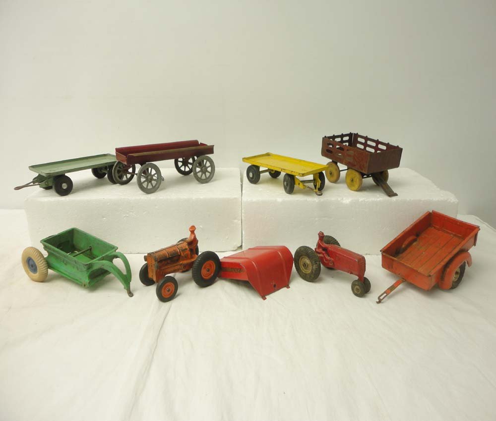 ABT: 9-item Assortment Tractors & Carts: Paul V. Ambrose and Drew J. Bauer present: This is 9-item assortment of Tractors and Carts by various Makers from the past. Included are two Tractors, six wheeled Carts, and loose Truck Bed as picture