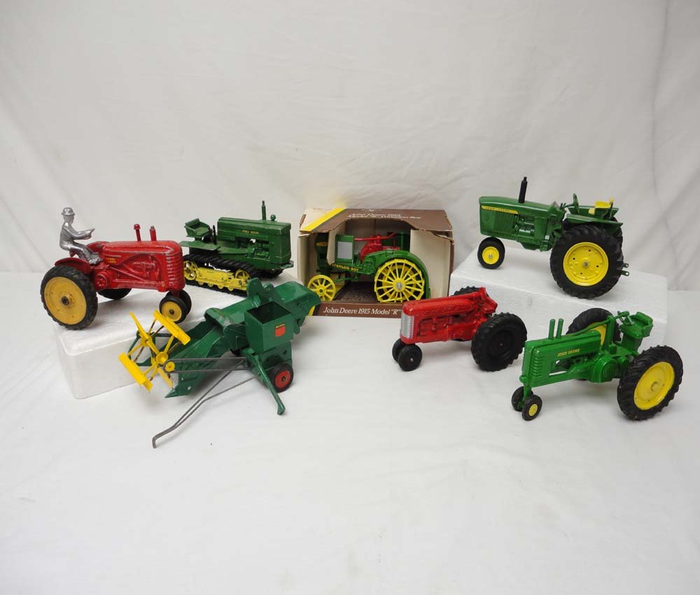 ABT: 6 Assorted Metal Tractors & Reaper/OB: Paul V. Ambrose and Drew J. Bauer present: These are six assorted metal Tractors (one with OB) and one Reaper by various Makers; some old, and some models from the not too distant past. Examine the pi