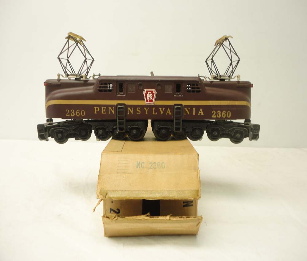 ABT: Lionel #2360 Pennsylvania Tuscan Solid-Stripe G: Paul V. Ambrose and Drew J. Bauer present: This is the #2360 Pennsylvania Solid-Stripe Heat-Stamped Variation GG1 Electric that Lionel made circa the early 1960s. Our Opinion is that it is generally i