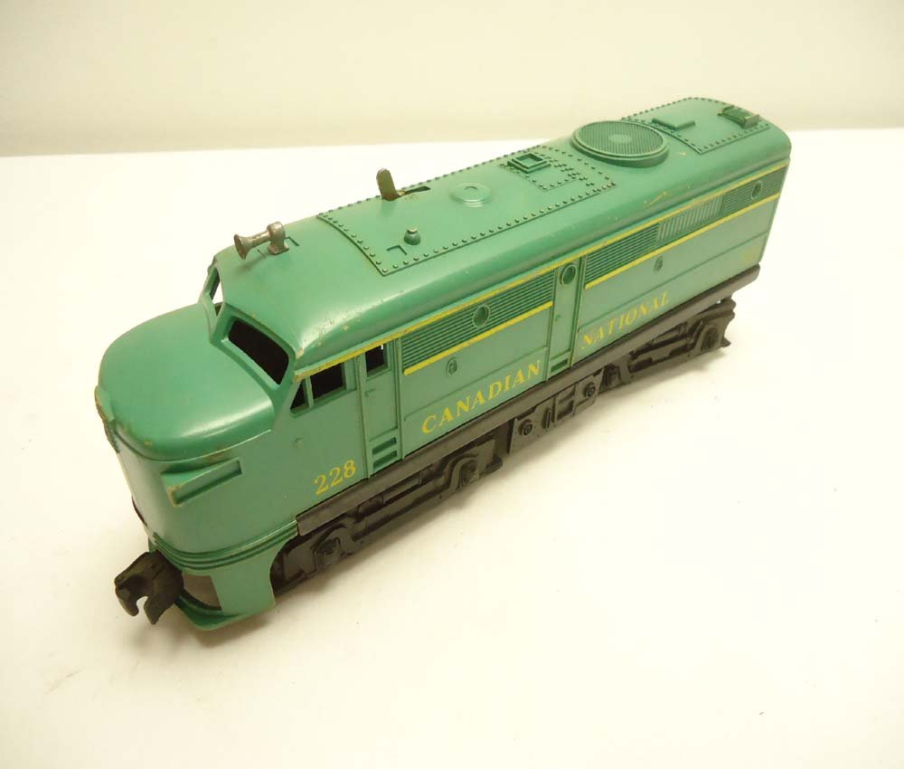 ABT: Lionel #228 Canadian National Alco A-Unit: Paul V. Ambrose and Drew J. Bauer present: This is the #228 Canadian National Alco A-unit Diesel that Lionel made in the late 1950s. Note Modern Era power-truck and motor. What is shown is what you wi