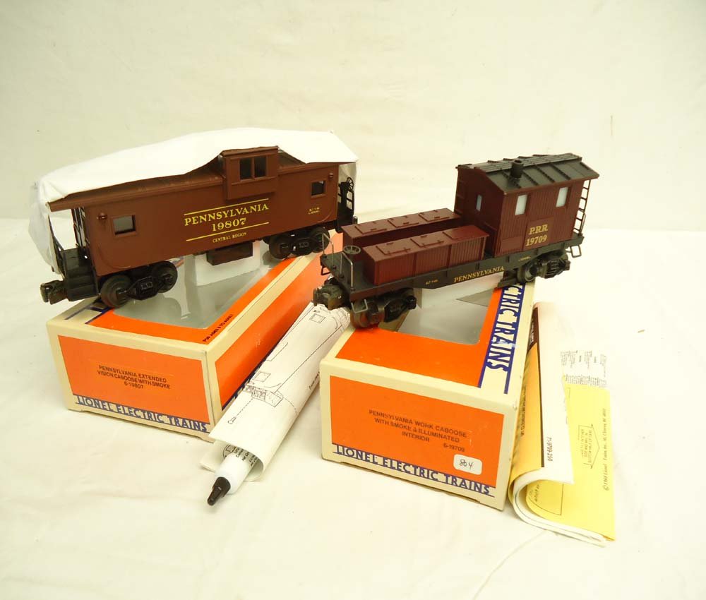 ABT: Mint Lionel #19807/19709 Pennsylvania Smoke C: Paul V. Ambrose and Drew J. Bauer present: These are the #19807 Pennsylvania Center-Cab Caboose and #19709 Pennsylvania Work Caboose, both with smoke, that Lionel made in the 1980s. Our Opinion is tha