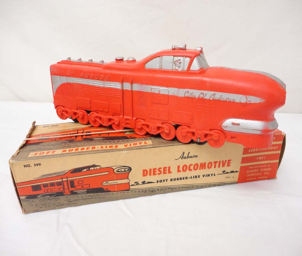 ABT: HO Auburn: Unusual Soft-Rubber/Vinyl Streamlin: Paul V. Ambrose and Drew J. Bauer present: This is the unusual soft-rubber/vinyl #599 'City of Auburn' Streamline Diesel that Auburn Rubber made circa the 1950s. Includes OB with amazing Graphics as s