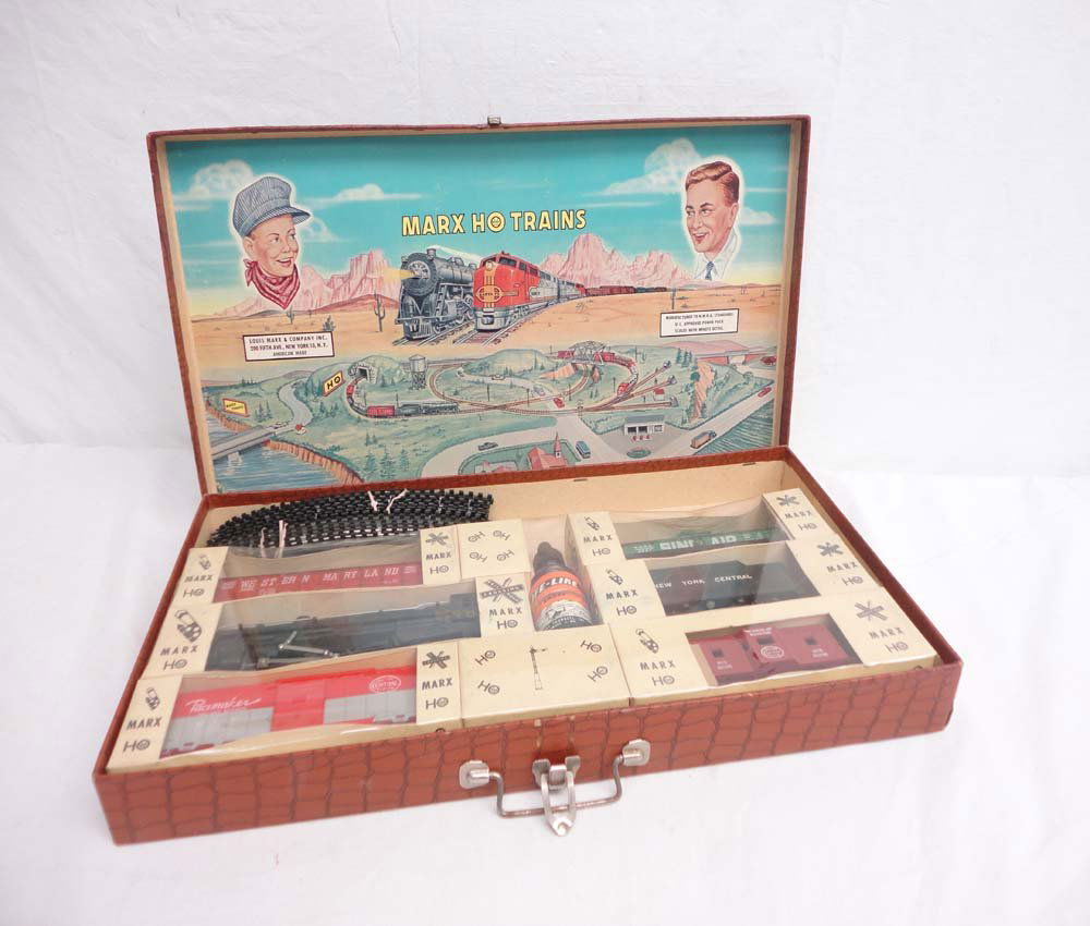 ABT: HO Marx: Interesting HO Freight Set w/Hinge T: Paul V. Ambrose and Drew J. Bauer present: This is an interesting HO Steam Freight Set in unusual hinged-top Box that Marx made circa the 1960s. Note the Engine and Rolling Stock are still sealed in o