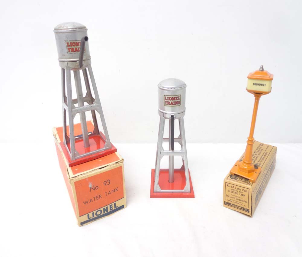 ABT: 2 Lionel #93 Water Towers & #57 Broadway Lamp/: Paul V. Ambrose and Drew J. Bauer present: These are two #93 Water Tanks and the #57 Broadway Lamp Post that Lionel made Pre-War. Inlcudes the boxes as shown. All Original in our Opinion. Please add $