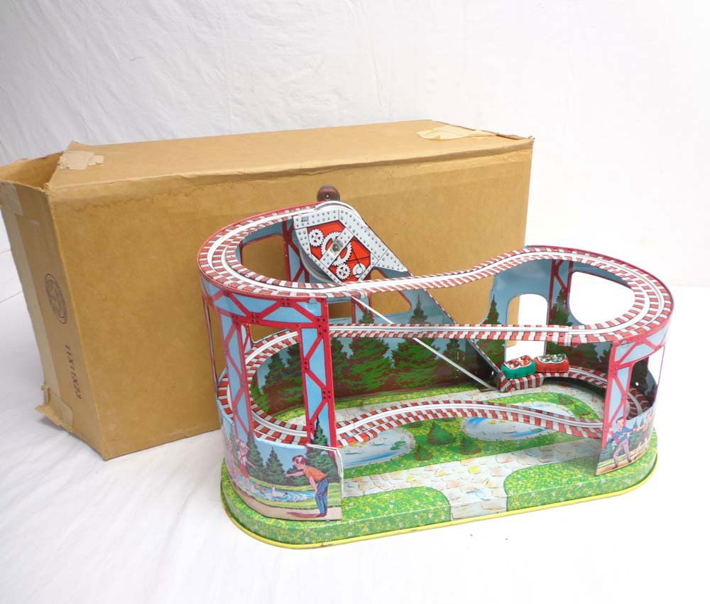 ABT: Wonderful Chein Clockwork Roller Coaster: Paul V. Ambrose and Drew J. Bauer present: This is an amazing Tinplate Clockwork Roller Coaster with two miniarure Coasters that Chein made circa 1950. Wondeful litography. It measures approx. 18-inch