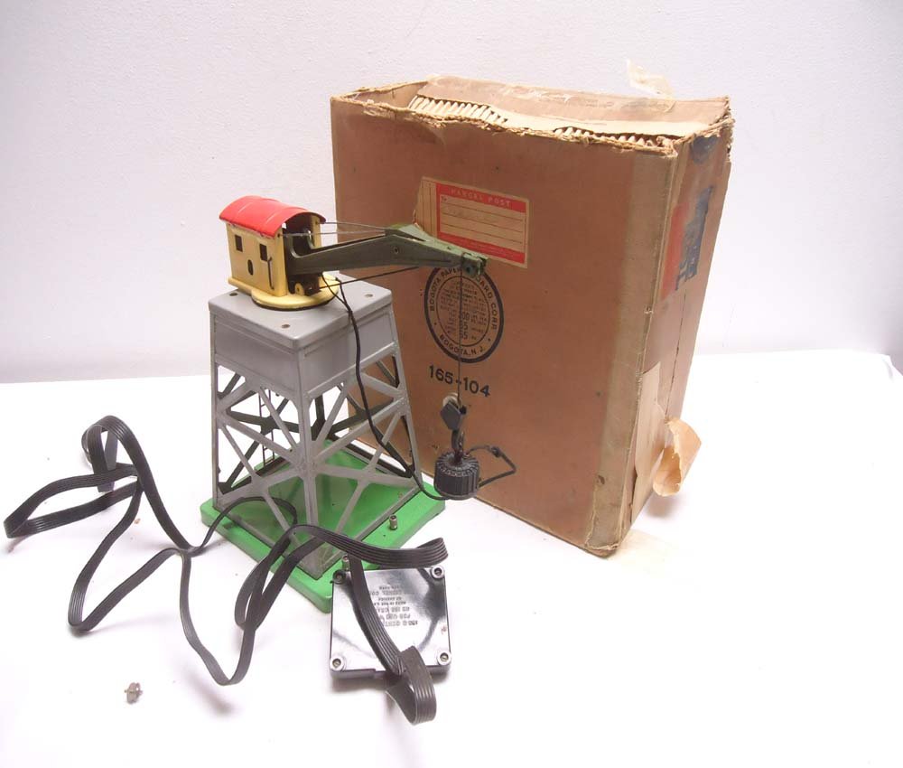 ABT: Lionel #165 Dark Gray Crane/OB: Paul V. Ambrose and Drew J. Bauer present: This is the #165 Dark Gray Remote Control Gantry Crane that Lionel made circa 1942. Our Opinion is that it is generally in Good Condition with age issues and