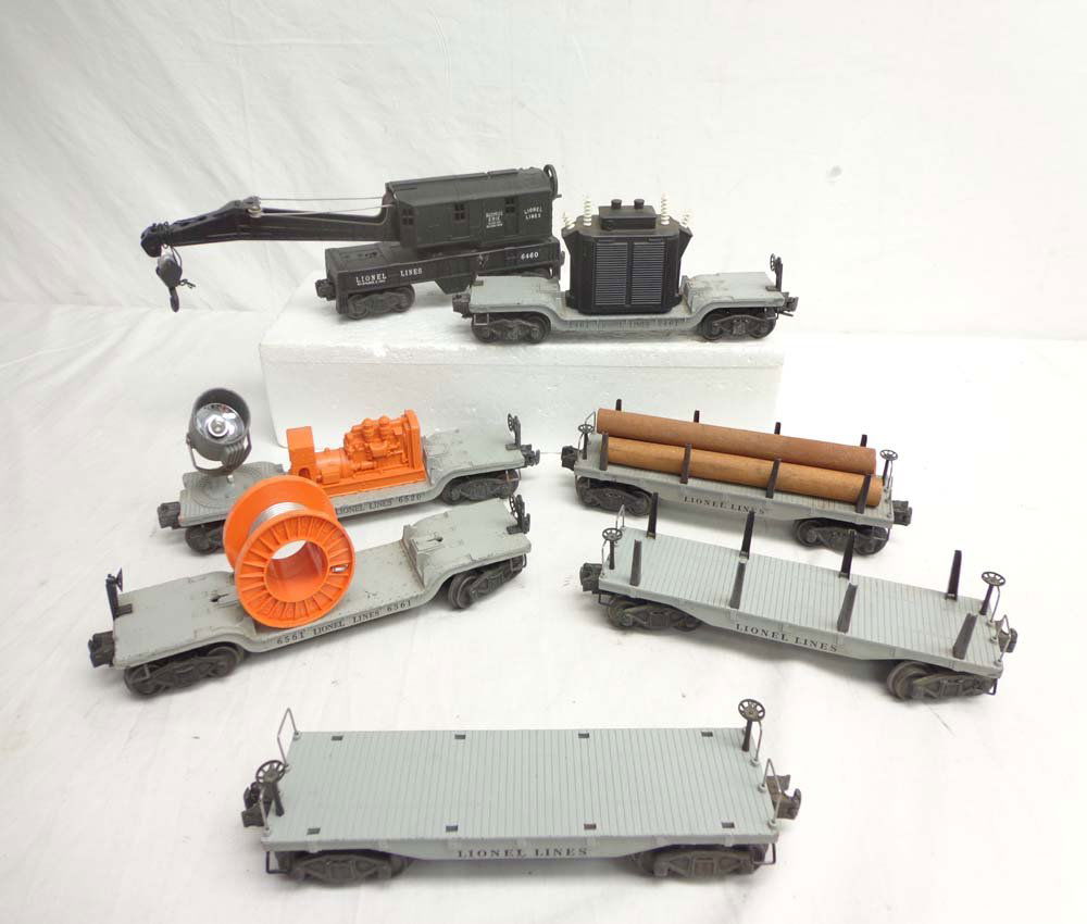 ABT: 7 Assorted Lionel Rolling Stock Items: Paul V. Ambrose and Drew J. Bauer present: These are seven assorted Rolling Stock items that Lionel made Post War. Included are #6460 Crane, #2461 Transformer Car, #6520 Searchlight Car, and four diec