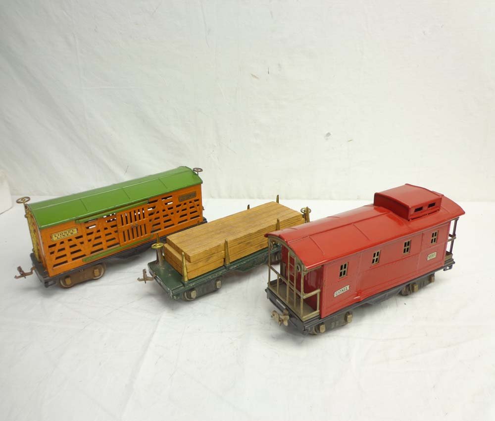 ABT: 3 Lionel Assorted Standard Gauge Rolling Stock Ite: Paul V. Ambrose and Drew J. Bauer present: These are the #513 Stock Car, #511 Flat Car w/load, and #517 Caboose (repainted) that Lionel made Pre War in Standard Gauge. No Boxes. Examine closely; what 