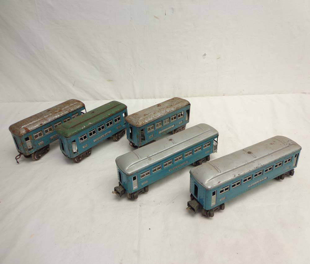 ABT: 5 Lionel Blue Tinplate Passenger Cars: Paul V. Ambrose and Drew J. Bauer present: These are the short #609, #609, #611, and #1630 and #1631 Blue Tinplate Passenger Cars that Lionel made Pre War. No Boxes. Examine closely; what is pictured