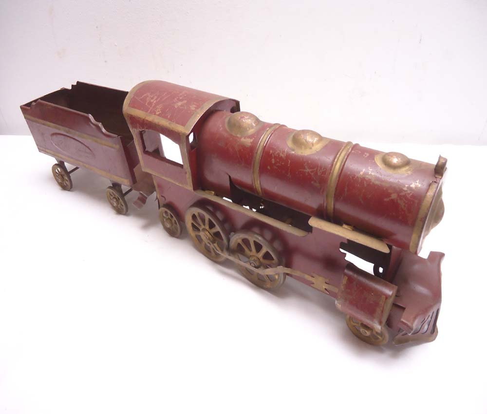 ABT: Unusual Hill Climber Floor Train: Paul V. Ambrose and Drew J. Bauer present: This is the unusual "Hill Climber' stamped-steel Floor Train with Tender that was made in Standard Gauge circa 1895. The Engine measures 15 Long x 7 High x 4