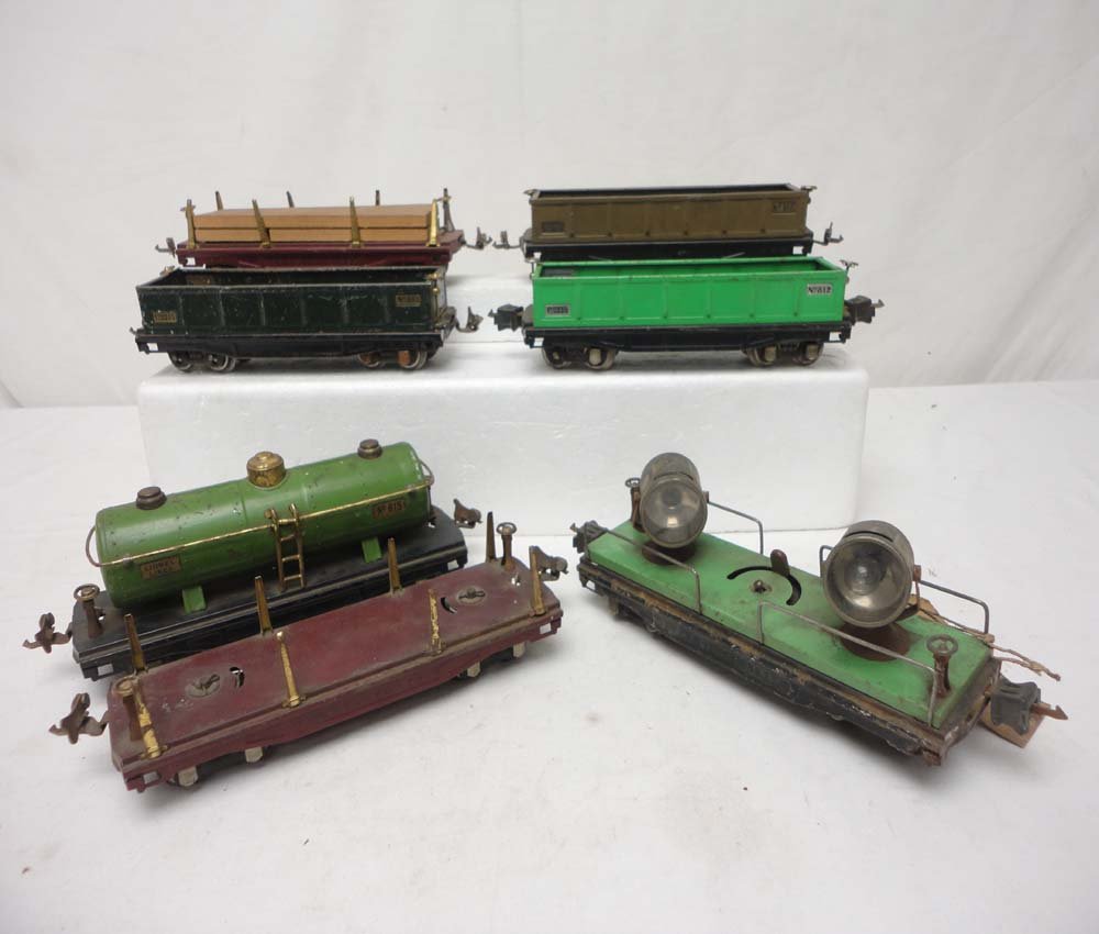 ABT: 7 Lionel #815/812/811/820 Freight Cars: Paul V. Ambrose and Drew J. Bauer present: These are the #815 Tank Car, three #812 Gondolas, two #811 Flat Cars, and the #820 Floodlight Car that Lionel made Pre War in O Gauge. No Boxes. Examine very