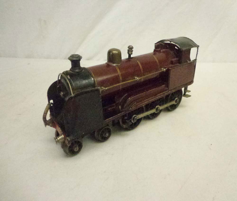 ABT: Marklin/Bing(?) Clockwork 4-6-0 Steam Engine: Paul V. Ambrose and Drew J. Bauer present: This is the 4-6-0 Clockwork Steam Engine that Marklin/Bing made in O gauge for export to England. Note loose roof, and import-stamp for "Gamages Ltd", the up