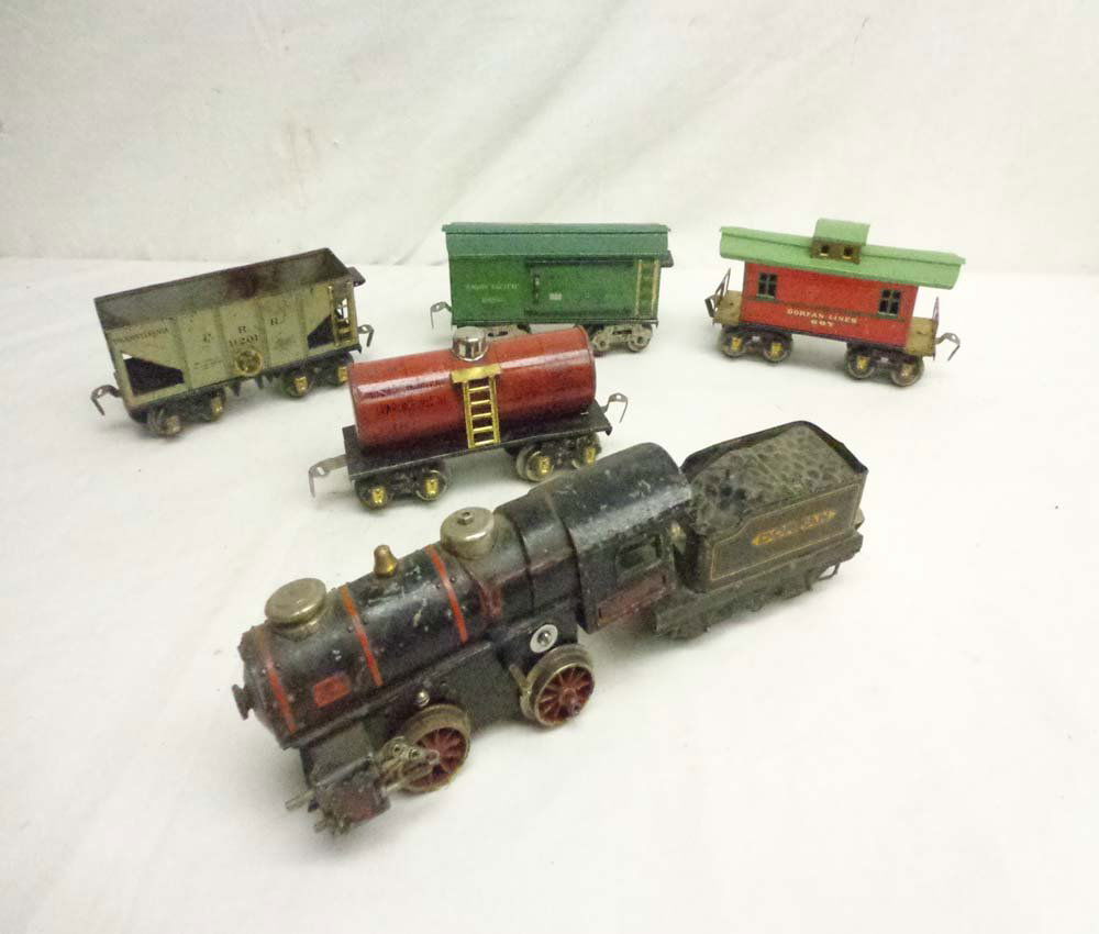 ABT: Scarce Dorfan Steam E&T plus 4 Rolling Stock Items: Paul V. Ambrose and Drew J. Bauer present: These are the clockwork Steam Engine and Tender plus four Rolling Stock items that Dorfan made circa the 1920s. No Boxes. Examine very closely; what is pictu