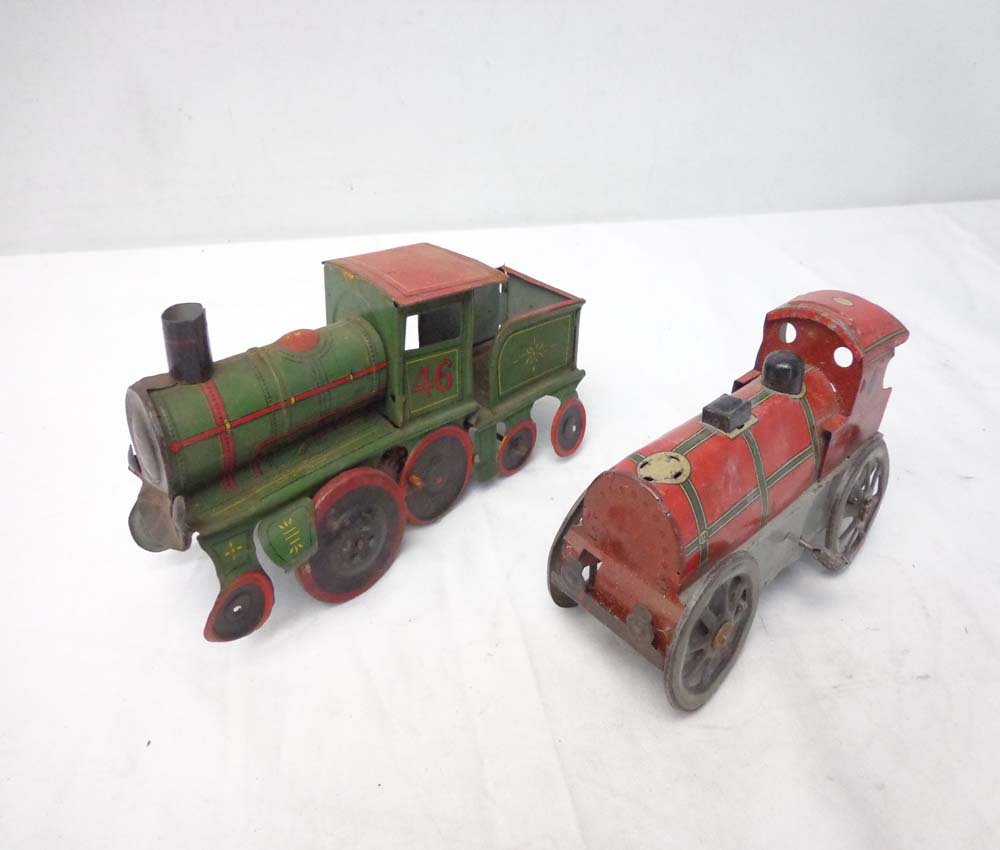 ABT: 2 Old & Unusual Friction Floor Trains: Paul V. Ambrose and Drew J. Bauer present: These are two old and quite interesting Floor Trains from time long, long ago. The Green #46 measures approx. 8-inches in length with Key and was made by Str
