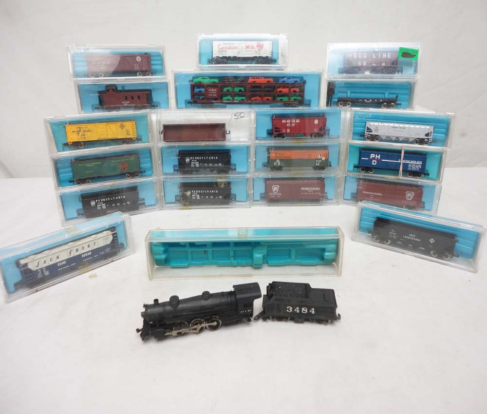 ABT: Atlas N Gauge: Steam Engine & Tender and 20 Assort: Paul V. Ambrose and Drew J. Bauer present: These are a Steam Engine and Tender and twenty Assorted Cars that Atlas made in N Gauge a few years ago. Please look at all the pictures; what is pictured is