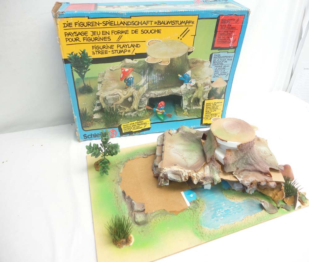 ABT: Schleich Smurf Figurine Playland Tree Stump/OB: Paul V. Ambrose and Drew J. Bauer present: This is the Schleich Smurf Figurine Playland Tree Stump. Please examine closely; what is pictured is what you will receive. Original Box. Please add $25.00 f