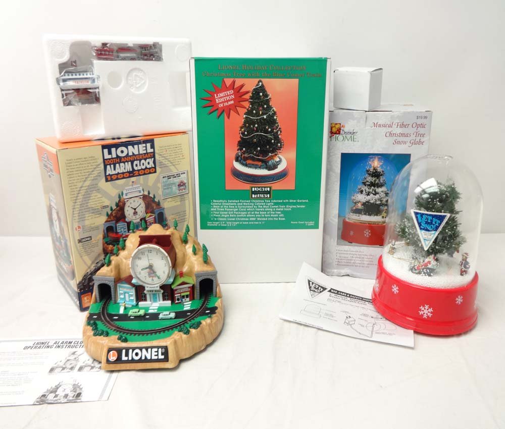 ABT: 3 Lionel/December Home Clocks & Figures/OBs: Paul V. Ambrose and Drew J. Bauer present: These are the Lionel/December Home Clocks & Figures, the #22991 Sealed Lionel Holiday Collection Christmas Tree w/ Blue Comet Train, the #7401 Lionel 100th A