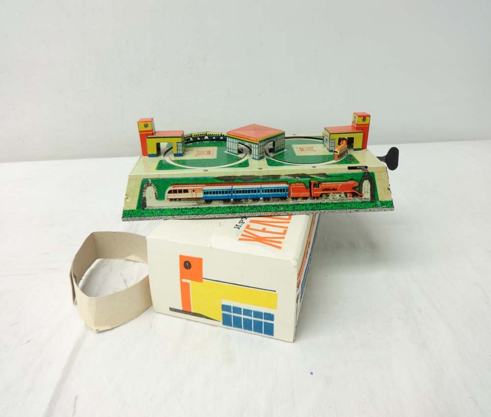 ABT: Unusual Russian Tin Wind-up Toy Train Set/OB: Paul V. Ambrose and Drew J. Bauer present: This is an unusual miniature Wind-Up Tin Train Toy Set w/Key that was made in Russia in the not too distant past. Note it measures approx. 9 1/2" X 4 1/2" wi