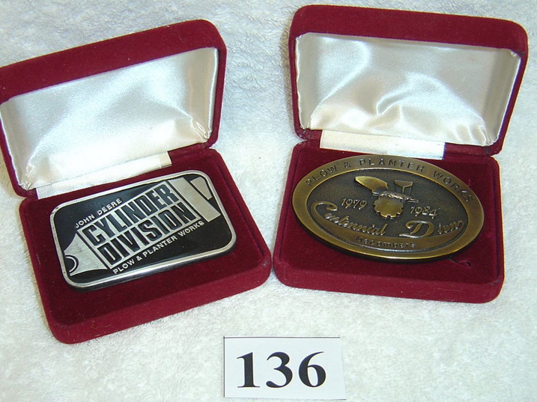RARE PAIR JOHN DEERE BELT BUCKLES LIMITED SERIAL: 1984 CYLINDER DIV. SN 48/1000 AND 1984 PLOW AND PLANTER WORKS SN 165/1500. MIB.