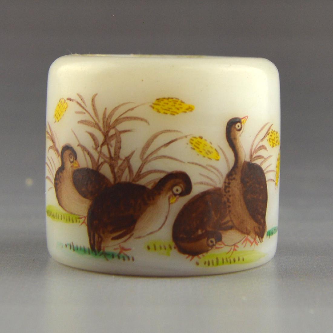 Painted White Jade Hunting Ring (Marked QianLongNianZi): A painted hunting ring made from white jade. Marked Qian Long Nian Zi.;Heightx3.9cm;Widthx3.3cm;Lengthx2.2cm;Weightx58.5g