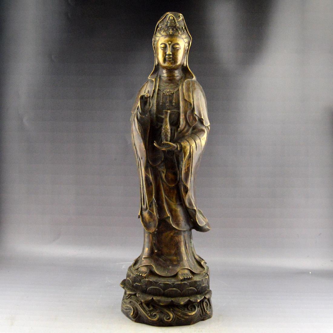 Bronze Guanyin Statue: 青銅觀音像A bronze crafted guanyin figure statue standing upon a lotus base. ; Height 440mm ; Width 130mm ; Length ; Weight