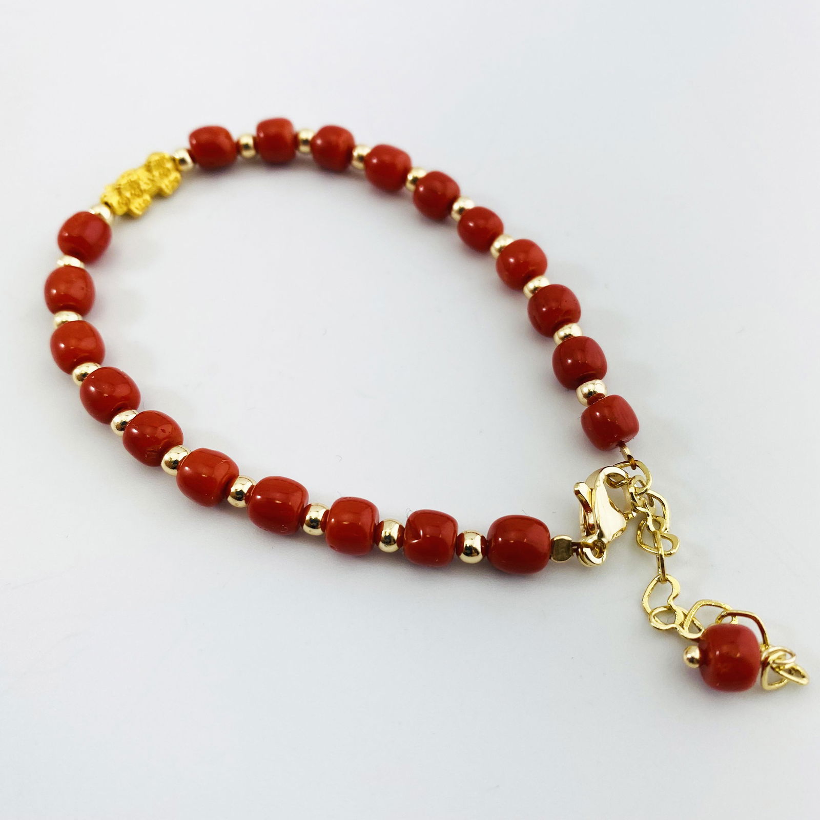 A Pair of 24K Gold Kylin Coral Beads Bracelets: A Pair of 24K Gold Kylin Coral Beads Bracelets. .